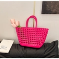 Detail of a magenta silicone hollow-out tote bag featuring diamond lattice weaving texture - Rose Red