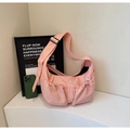 Pink pleated nylon crossbody bag with dual drawstring pockets and adjustable wide strap - Pink