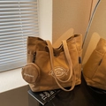 Khaki canvas tote bag with matching round coin purse and dual handles for daily commute - Brown