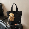 Black nylon tote bag with a cute plush bear pendant and white letter logo detail - Black (With Charm)