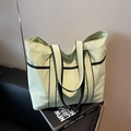 Minimalist mint green large capacity tote bag with black straps and nylon texture - Green
