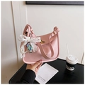 Pink lychee texture leather handbag featuring lace bow and pearl charm details - Pink