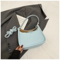 Light blue lychee texture hobo bag with adjustable strap on a dark grey blazer - Light Blue Without Pendant