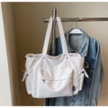 Close-up of white tote bag with large zipper pocket and bright yellow drawstring details - One Size / Off White