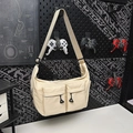 Beige oversized nylon messenger bag with double front pockets and adjustable strap - Khaki