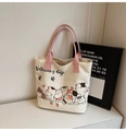 Detail van canvas draagtas met Valentine's Day kattenprint en roze geweven grepen - Roze