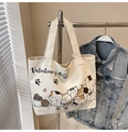 Off-white canvas tote bag featuring cartoon cat illustration and Valentine's day print - Brown