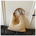 Close-up of woven tote bag featuring hollow texture and brown leather shoulder strap - Khaki