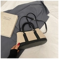 Minimalist beige canvas bucket bag with black leather trim and detachable shoulder strap - Black without Pendant