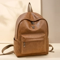Deep brown faux leather backpack with silver rabbit logo and front zipper pocket - Brown
