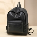 Minimalist black PU leather backpack for women featuring a metallic alien emblem detail - Black
