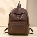 Deep brown vintage leather backpack with silver rabbit logo and front zipper pocket - Coffee