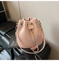 Detailed view of the pale pink pleated bucket bag with silver chain and drawstring closure - Pink