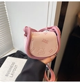 Pink mini crossbody saddle bag featuring cute embossed bear and chunky handle design - Pink