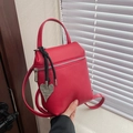 Mini rode crossbodytas van leer met lychee-textuur en een hartvormige hanger - Rood met Hanger