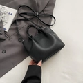 Elegant black lychee grain leather bucket bag with unique knotted handle and strap - Black without Pendant