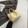 Elegant cream yellow crossbody bucket bag with textured leather and knotted handle detail - Yellow Without Pendant