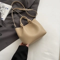 Minimalist beige pebble leather bucket bag with knotted handles and adjustable strap - Dark Khaki Without Pendant