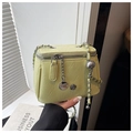 Detail of light green mini box bag with chain strap and metallic camellia floral charm - Large / Green