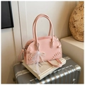 Pink semi-circular leather tote bag featuring pearl lace bow charm and crossbody strap - With Pendant / Pink