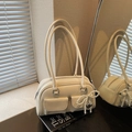 Cream lychee leather bowling shoulder bag with pearl bow and dual front pockets - Cream White With Pendant