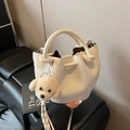 Creamy white litchi pattern bucket bag with a cute brown poodle plush charm - With Pendant / Off White