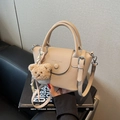 Cream white bucket bag with pebble leather texture and cute teddy bear charm - Khaki