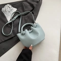 Light blue bucket bag with lychee grain leather and twisted handle detail for women - No Pendant / Blue