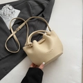 Chic apricot lychee leather bucket bag with knotted handle and crossbody strap - No Pendant / Yellow