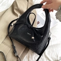 Chic black crescent underarm bag with silver bead bow and adjustable strap detail - Black