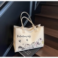 Cremeweiße Canvas-Tragetasche mit Valentinstag-Katzen-Illustration und schwarzen Tragegriffen - Gebrochenes Weiß