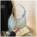 Light blue crescent shoulder bag with crocodile pattern and metallic zipper closure - Blue