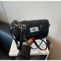 Detail of glossy black quilted leather mini bag with silver chain and twist lock - Black