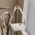 Chic cream-colored leather croissant bag with wide shoulder strap and lychee pattern - Small / White