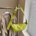Lime green crescent crossbody bag with textured PU leather and silver metal eyelets - Small / Green