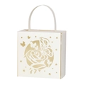 Macro detail of laser-cut butterfly and rose pattern on pearlized ivory wedding favor box - Ivory