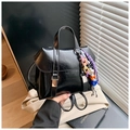 Black shiny PU leather dual-use backpack with colorful beaded charm in a lifestyle setting - With Charm Style / Black