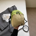 Minimalist shell crossbody bag in green and beige contrast with braided rope strap - Off-white