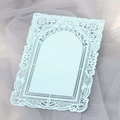 Macro shot of light blue laser-cut lace decorative card with delicate floral edges - Pearl Pale Blue