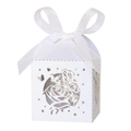 Detail of white laser-cut wedding candy box with rose patterns and a silk ribbon bow - White