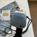 Blue denim and white canvas crossbody bag with woven rope strap and zipper detail - Blue