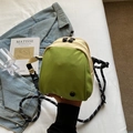 Minimalist shell crossbody bag in green and beige nylon with adjustable woven strap - Fruit Green
