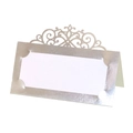Macro shot of silver laser-cut place card with ornate European hollow patterns - Reflective Silver
