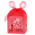 Detailed laser-cut tropical leaf patterns on a vibrant red favor box with silk ribbon - Pearlescent Red