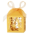 Detail of laser-cut hollow floral pattern on yellow candy box with ribbon bow - Gold