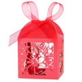 Macro detail of laser-cut cherry blossom patterns on red gift box with silk ribbon - Pearlescent Red
