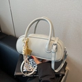 Light grey litchi texture pillow handbag with adjustable strap and decorative charm - Gray With Pendant