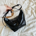 Glossy black hobo bag with adjustable leather strap and decorative silver chain - Black