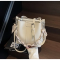 Off-white lychee leather bucket bag featuring a decorative heart pattern silk scarf chain - Off-white