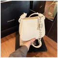 Creamy textured leather bucket bag with knotted handle and striped silk scarf detail - Off White